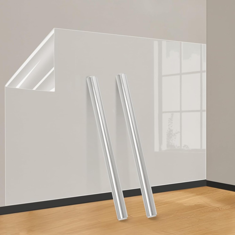 Two rolls of clear electrostatic wall protector film in front of a white wall covered with the transparent film