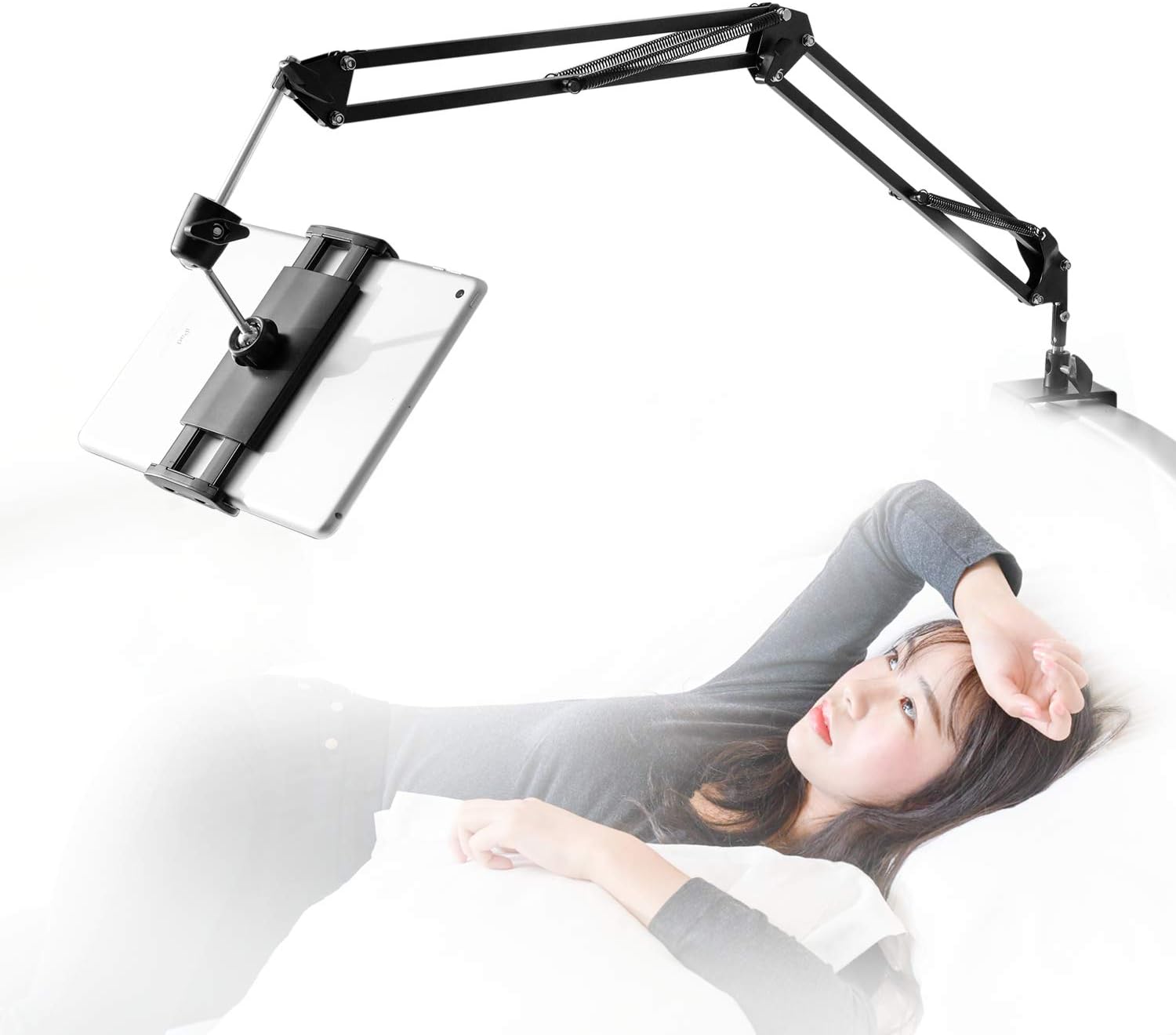 Tablet holder for bed with four-joint aluminium arm clamped to a headboard holding a tablet